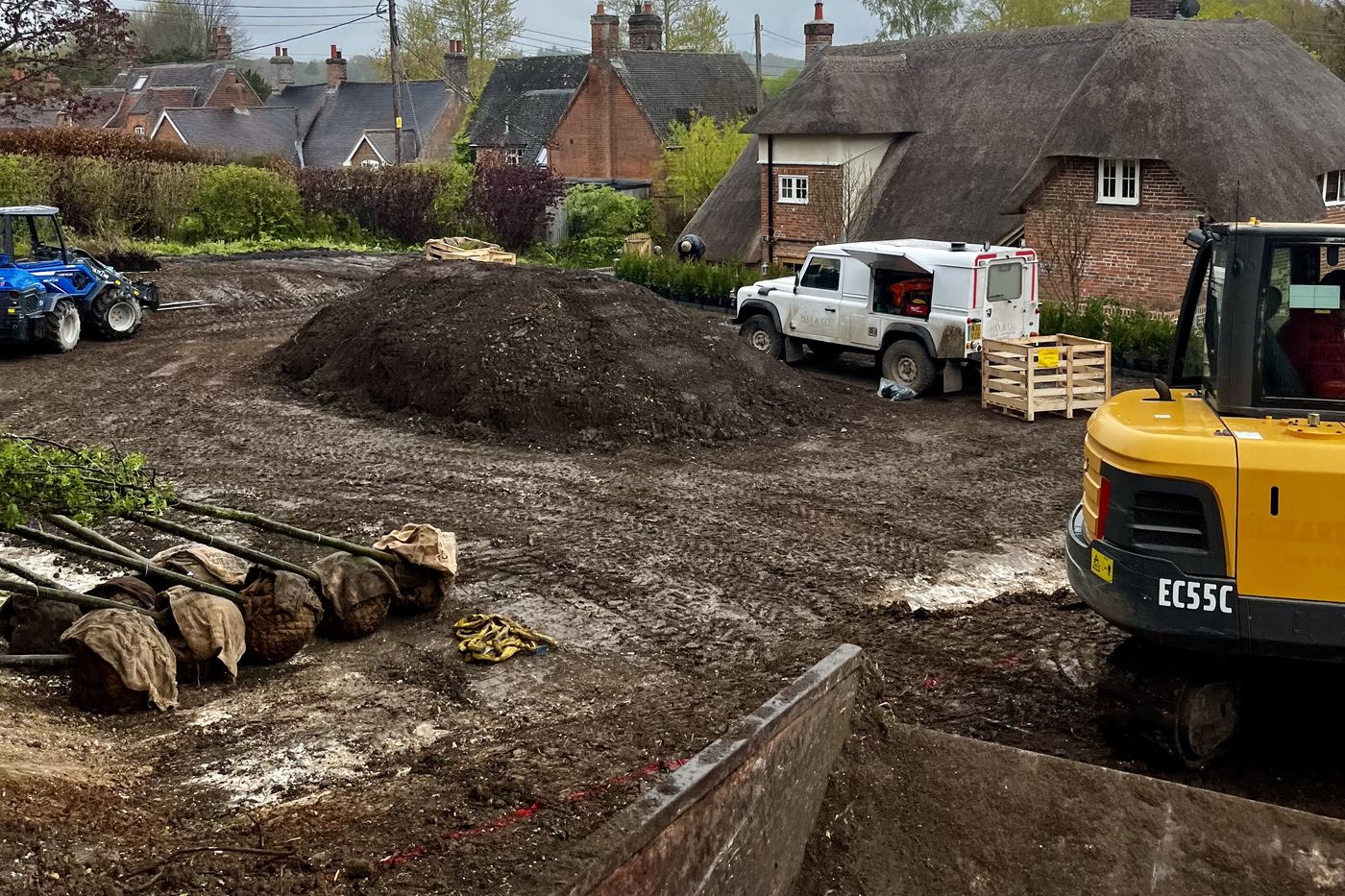 Volvo EC55C working a groundworks job beside thatched cottages in a Bourne Valley village