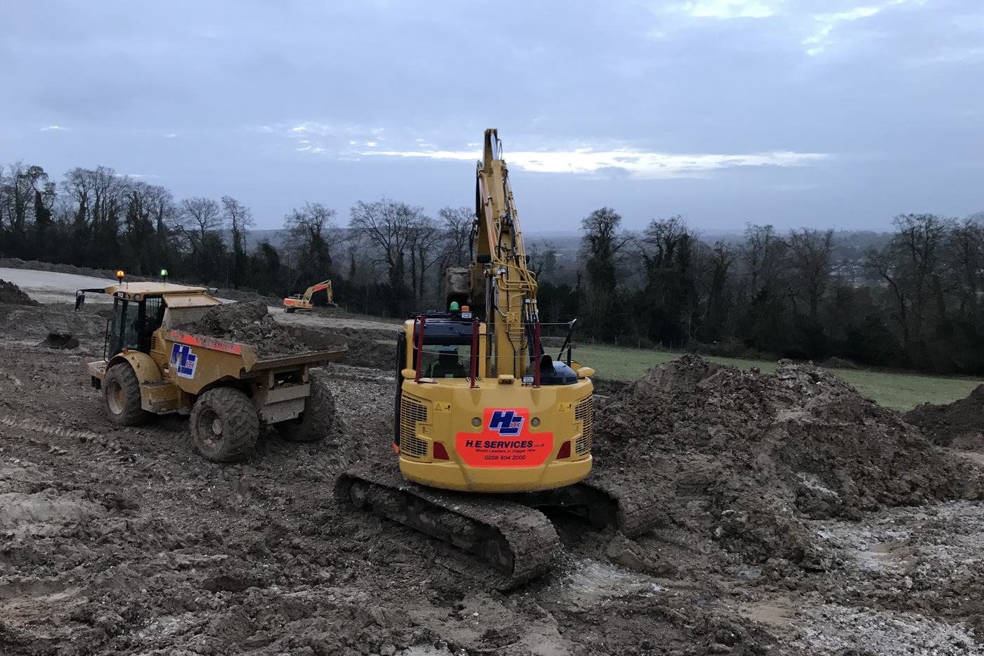 Excavator and dumper working a muck shift on a wet site