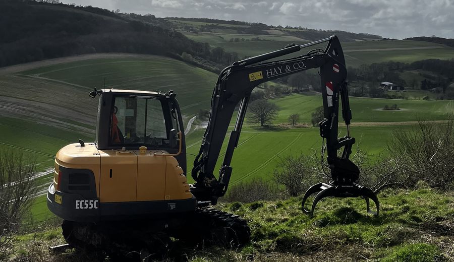 Volvo EC55C 6-tonne excavator with selector grab on low-ground-pressure tracks